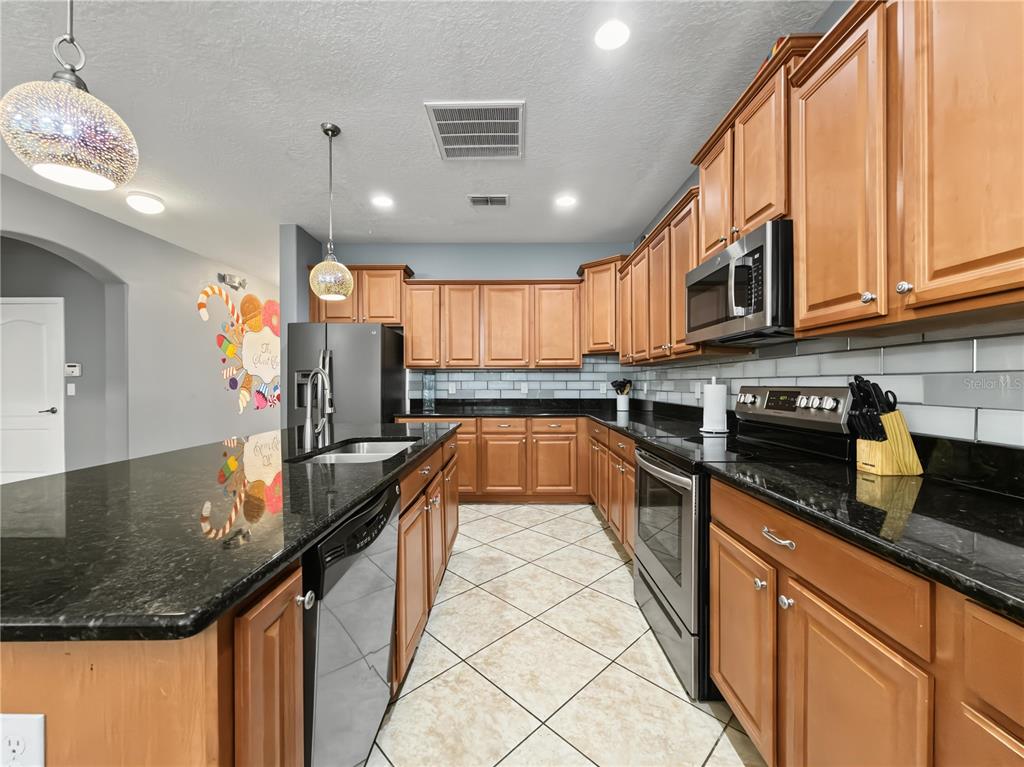 8854 Candy Palm Road Kissimmee, FL 34747 - Photo 8 of 51 Gallery Image 8
