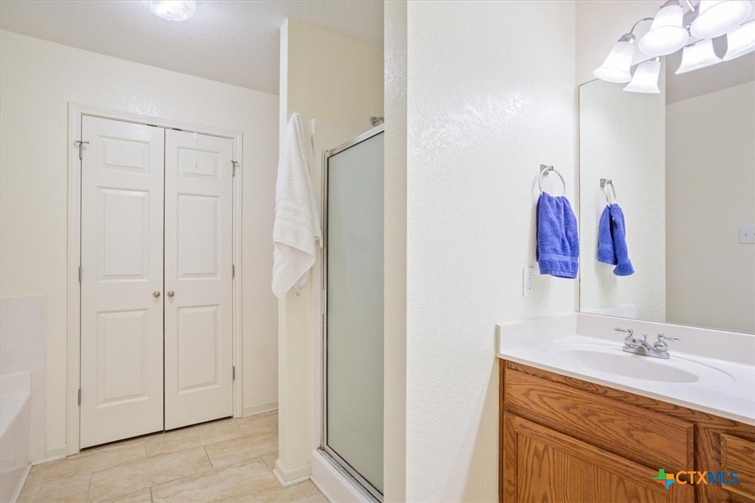 2817 North 12th Street Temple, TX 76501 - Photo 15 of 23 a bathroom with a double vanity sink and a mirror