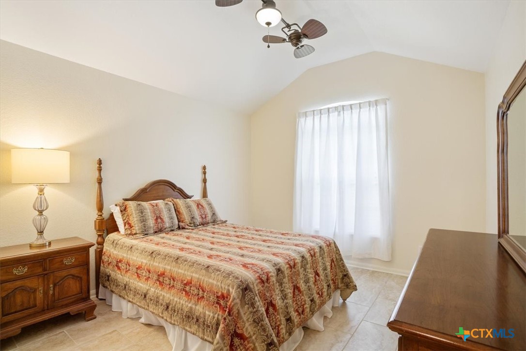 2817 North 12th Street Temple, TX 76501 - Photo 17 of 23 a bedroom with a bed and a night stand