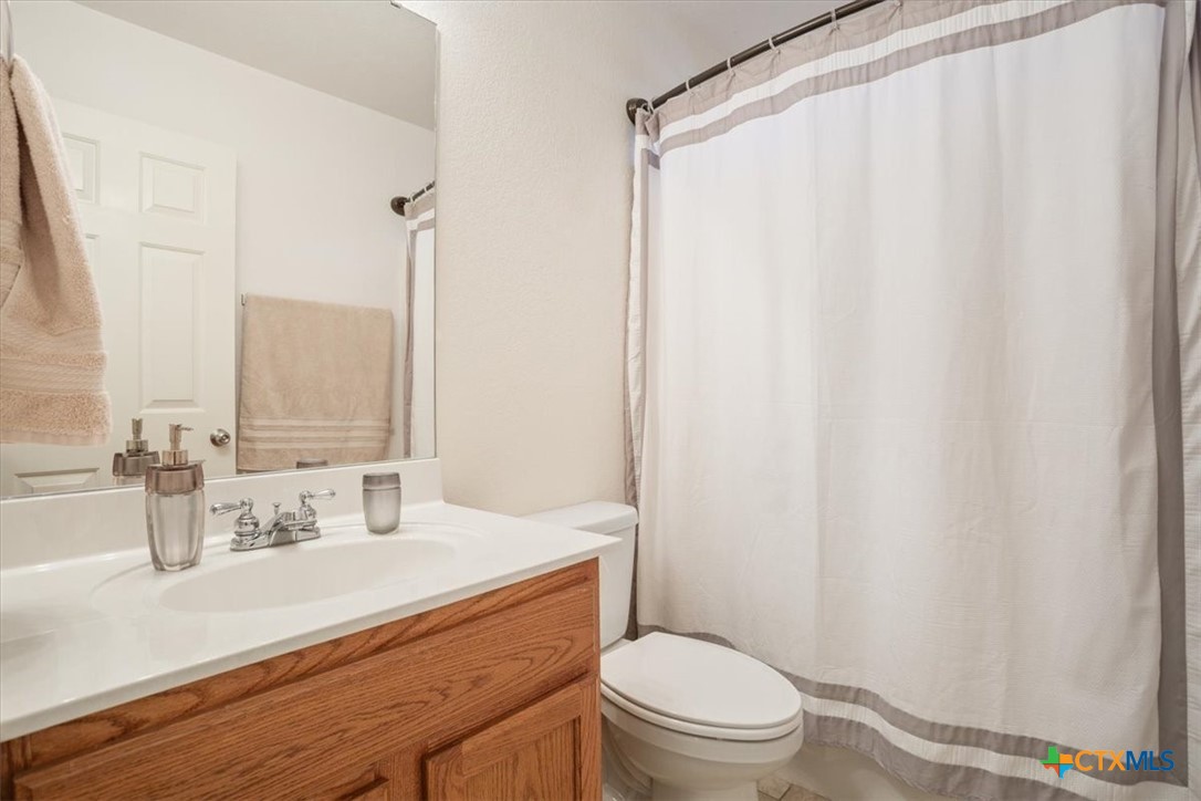 2817 North 12th Street Temple, TX 76501 - Photo 19 of 23 a bathroom with a sink a toilet and shower