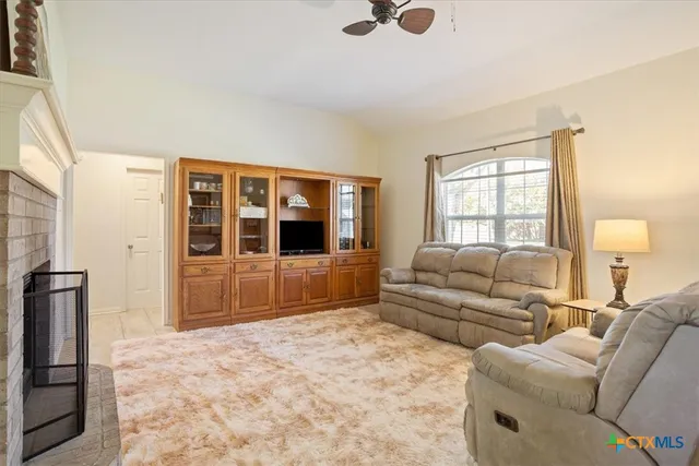 a living room with furniture window and a flat screen tv