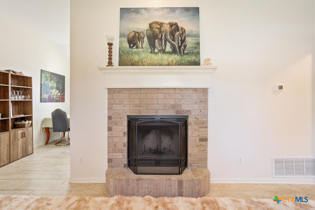 2817 North 12th Street Temple, TX 76501 - Photo 7 of 23 a living room with furniture and a fireplace