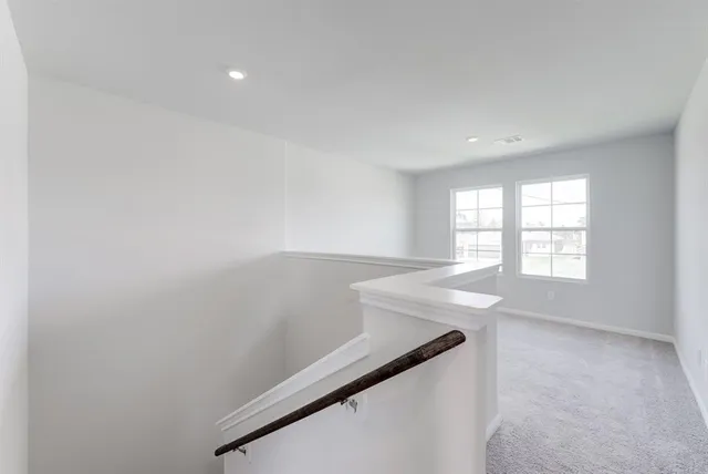a bathroom with a bathtub and a toilet