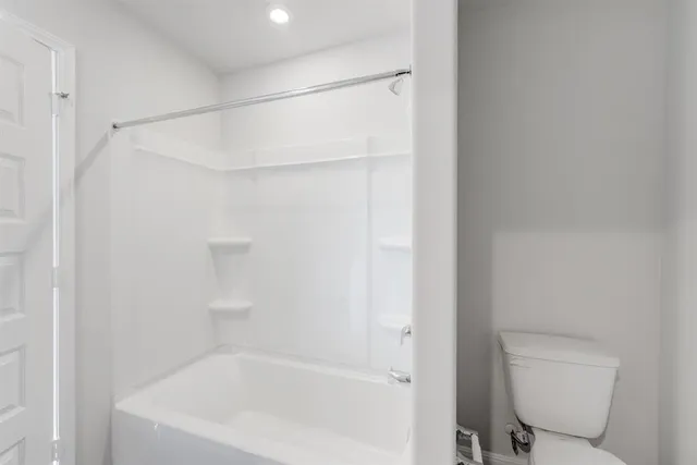 a bathroom with a sink a toilet and a bathtub
