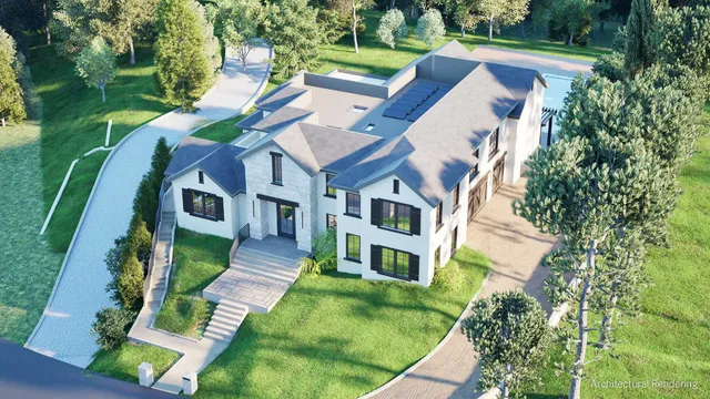 an aerial view of a house with a yard