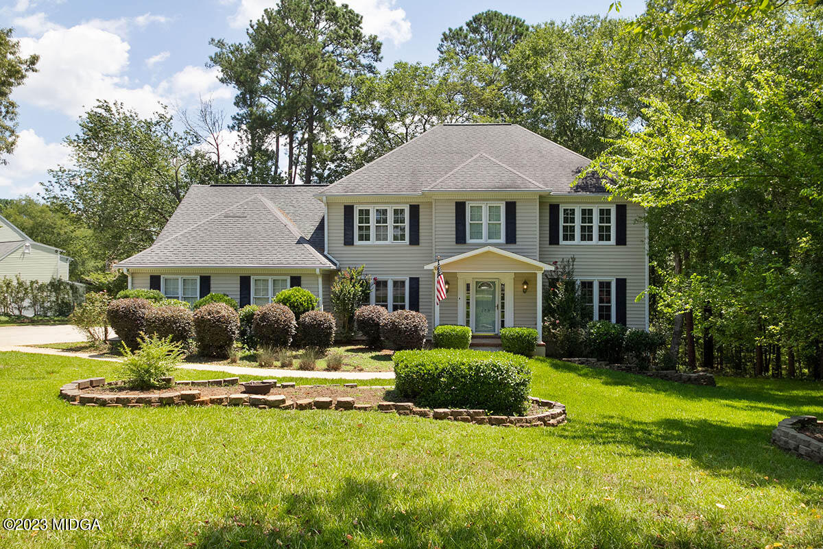 a front view of a house with a yard table and chairs