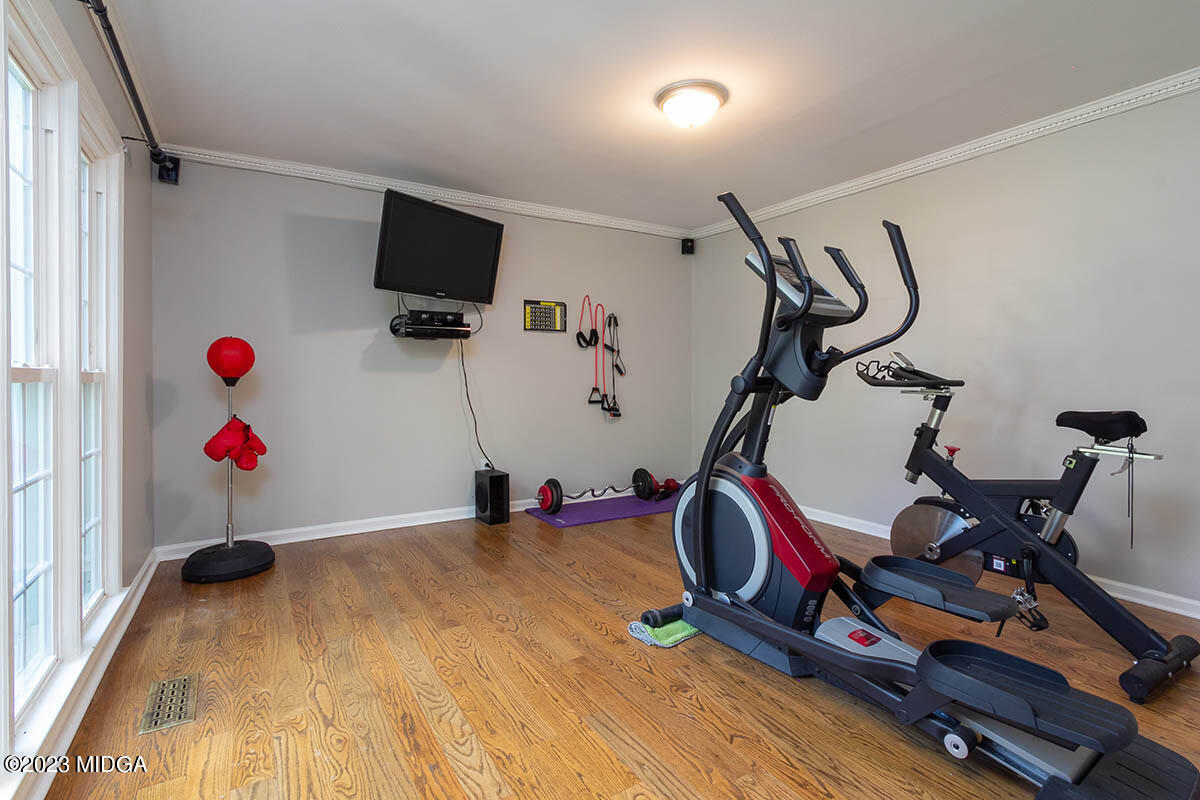 173 Old Ridge Road Macon, GA 31211 - Photo 11 of 37 a room with gym equipment and wooden floor