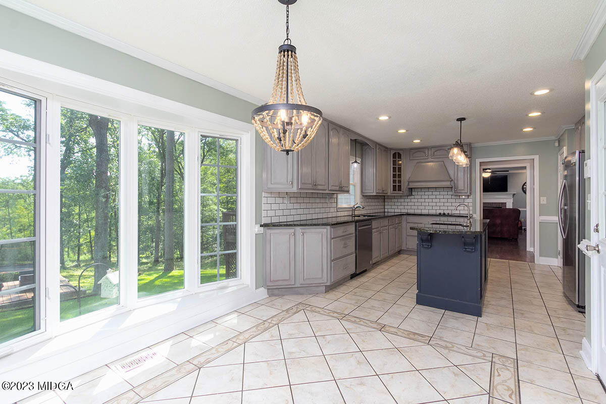 173 Old Ridge Road Macon, GA 31211 - Photo 17 of 37 a kitchen with stainless steel appliances granite countertop a stove a sink dishwasher and a refrigerator