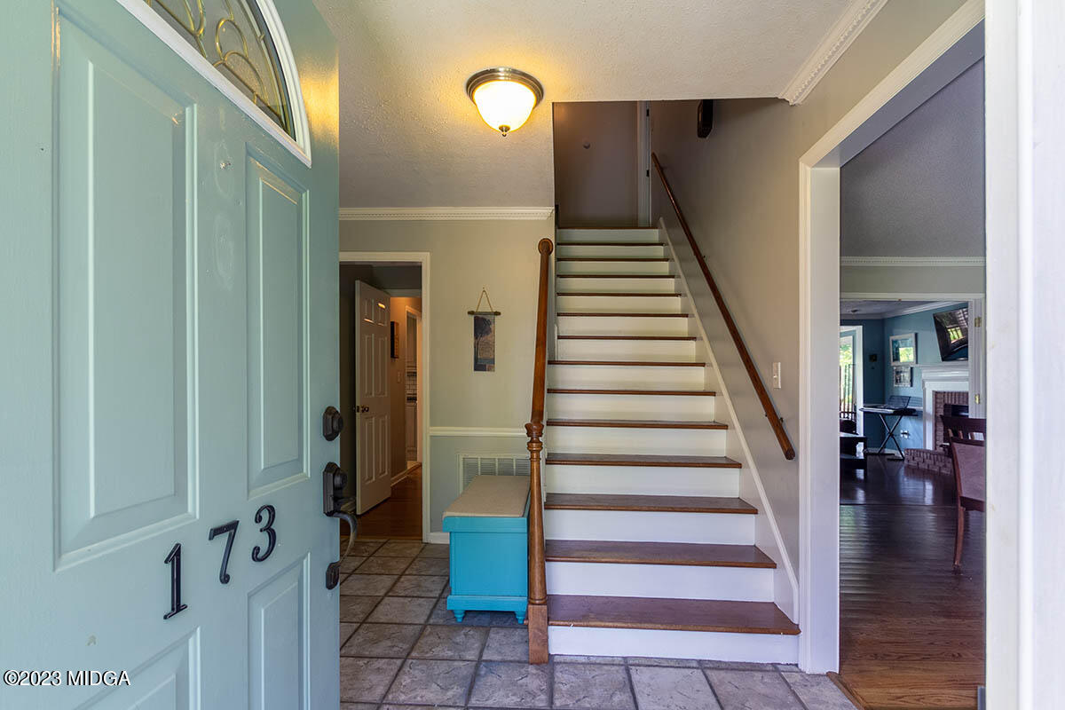 173 Old Ridge Road Macon, GA 31211 - Photo 19 of 37 a view of entryway with wooden floor and stairs