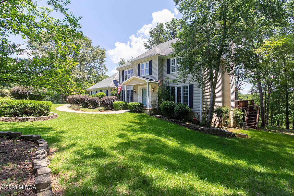 173 Old Ridge Road Macon, GA 31211 - Photo 2 of 37 a front view of a house with a yard table and chairs
