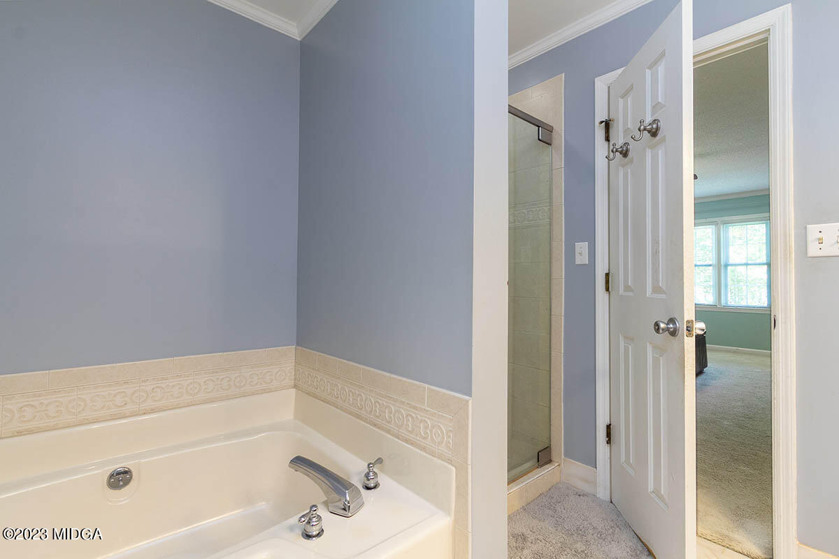 173 Old Ridge Road Macon, GA 31211 - Photo 25 of 37 a bathroom with a bathtub