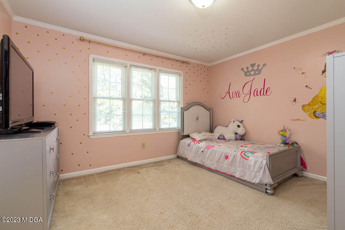 173 Old Ridge Road Macon, GA 31211 - Photo 26 of 37 a bedroom with a bed and a window