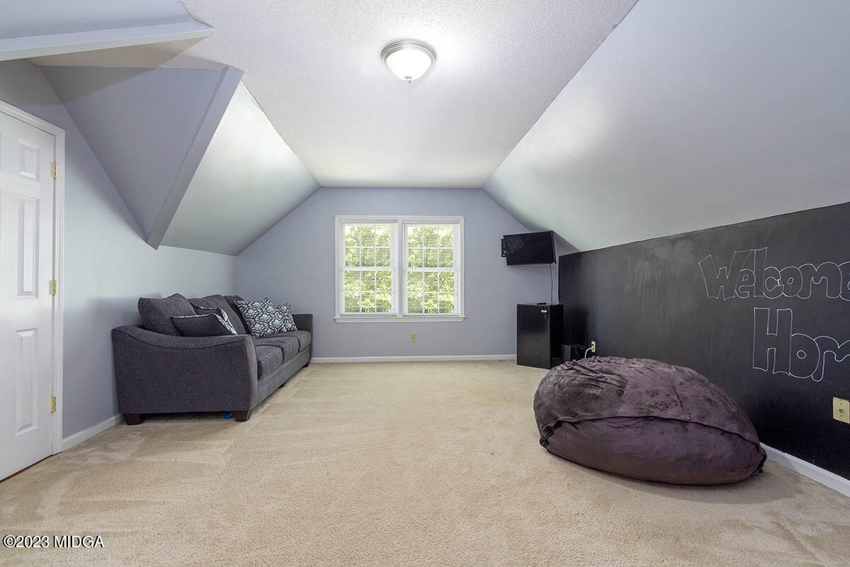 173 Old Ridge Road Macon, GA 31211 - Photo 27 of 37 a bedroom with furniture and a window