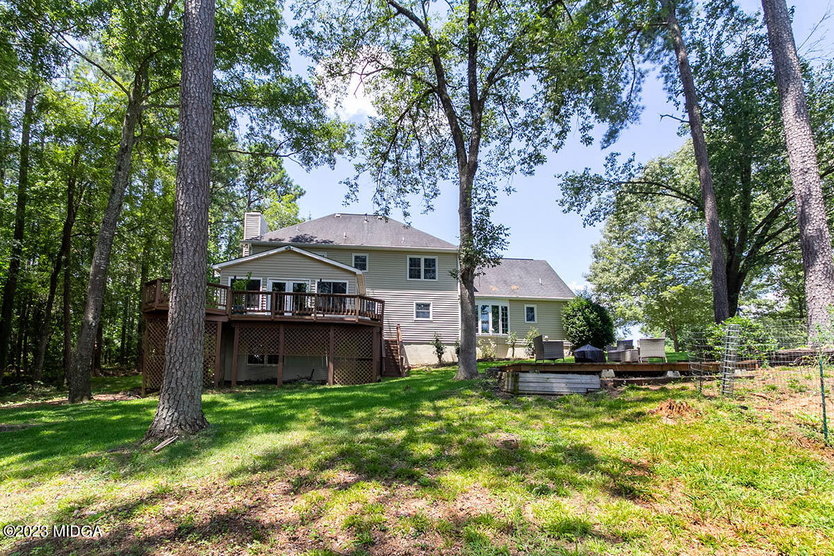 173 Old Ridge Road Macon, GA 31211 - Photo 37 of 37 a front view of a house with a yard table and chairs
