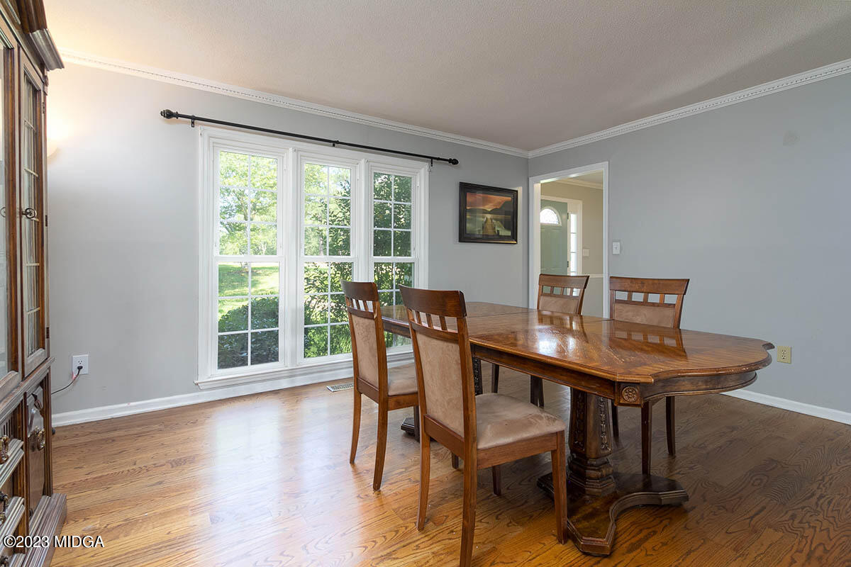 173 Old Ridge Road Macon, GA 31211 - Photo 4 of 37 a view of a dining room with furniture window and wooden floor