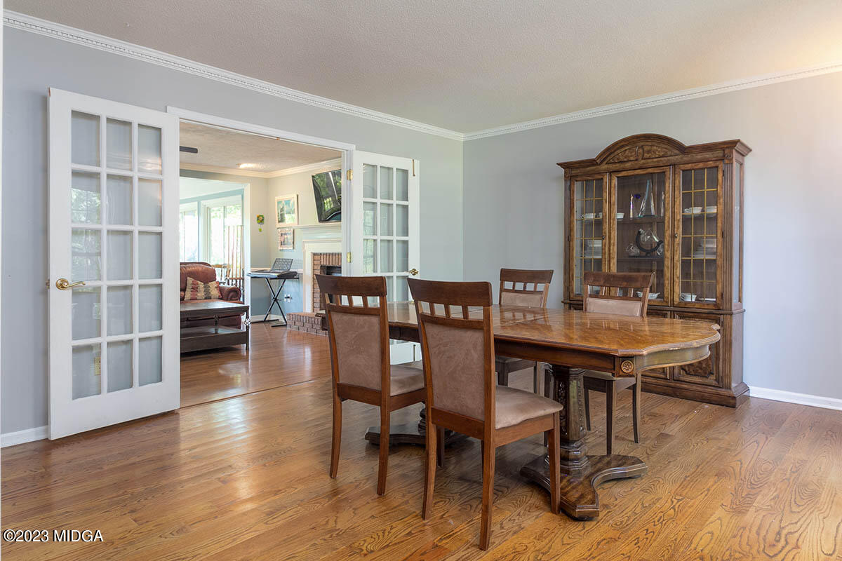 173 Old Ridge Road Macon, GA 31211 - Photo 5 of 37 a view of a dining room with furniture and wooden floor