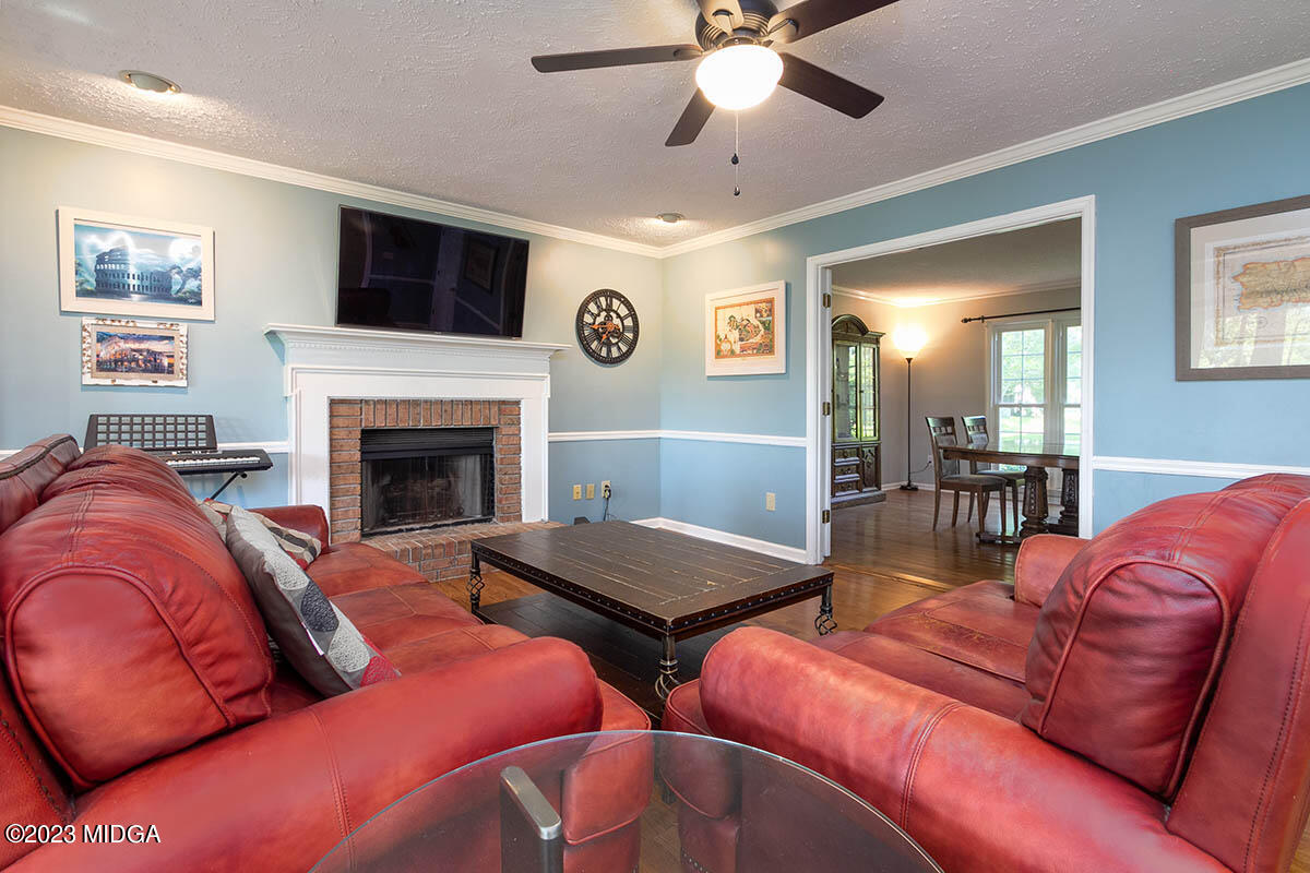 173 Old Ridge Road Macon, GA 31211 - Photo 7 of 37 a living room with furniture fireplace and window