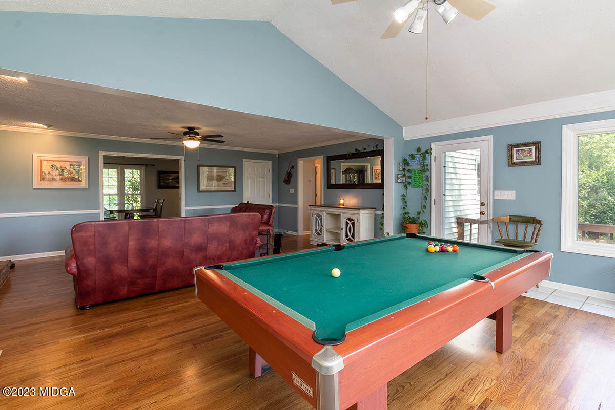 173 Old Ridge Road Macon, GA 31211 - Photo 8 of 37 a living room with furniture pool table and windows