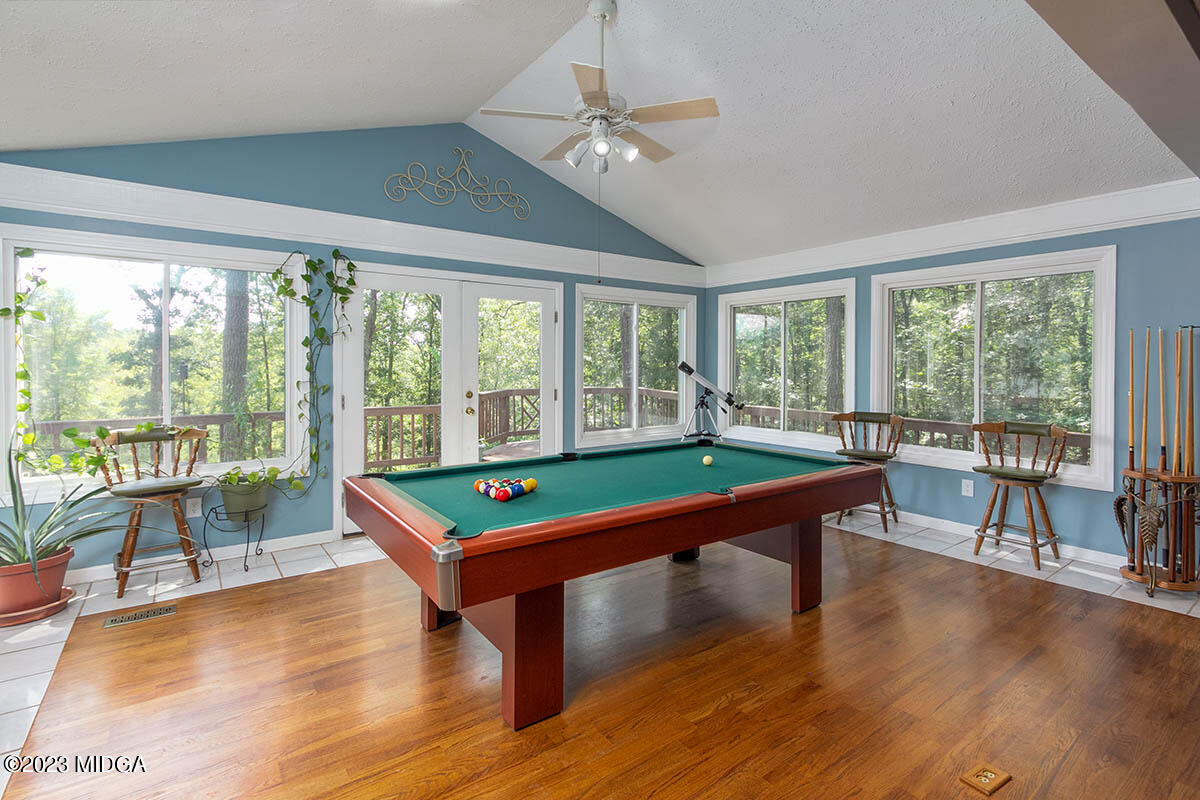 173 Old Ridge Road Macon, GA 31211 - Photo 9 of 37 a room with pool table and a floor to ceiling window