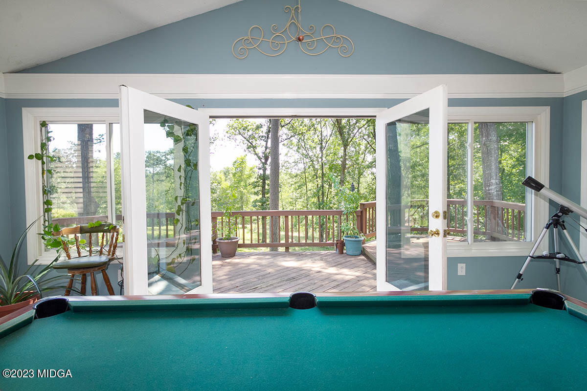173 Old Ridge Road Macon, GA 31211 - Photo 10 of 37 a spacious bedroom with a large bed and a large window