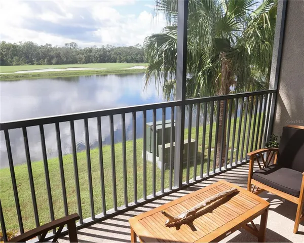 a view of a swimming pool with sitting area