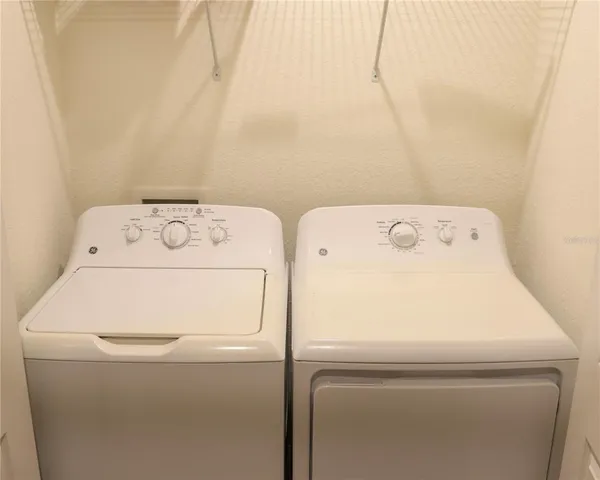 an aerial view of a house with a swimming pool outdoor seating and yard