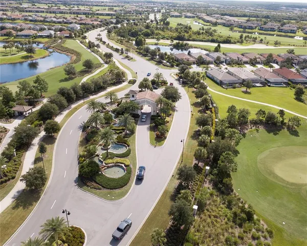 a front view of house with yard and swimming pool