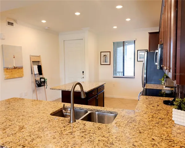 a view of a dining room with furniture and window