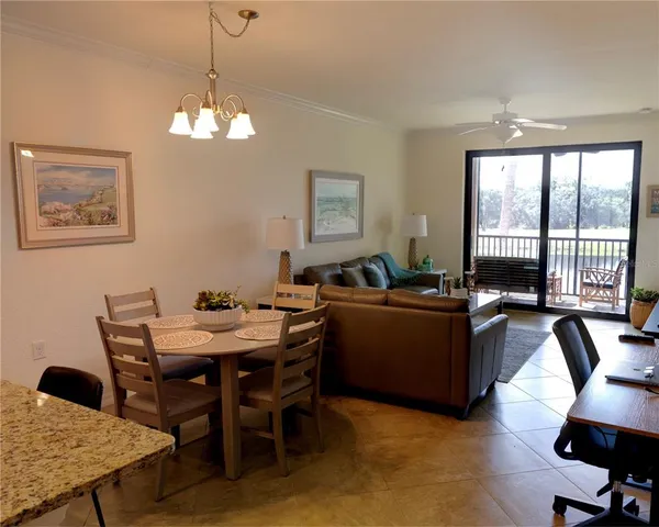 a living room with furniture and a lamp