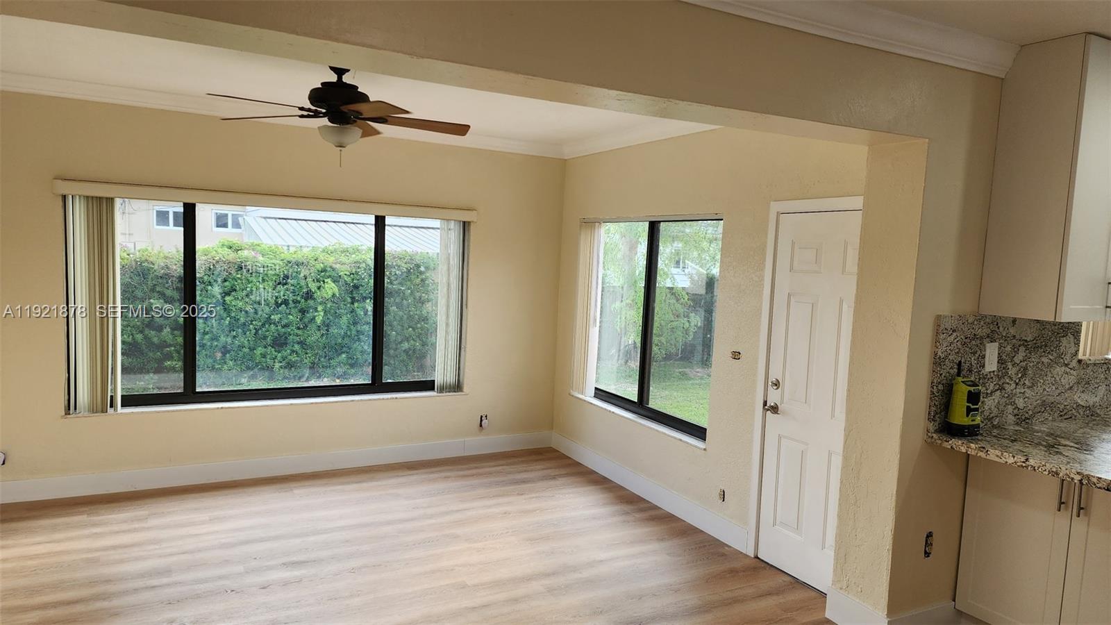 8010 Southwest 16th Street, Unit 8010 Miami, FL 33155 - Photo 11 of 33 a view of hallway with windows and wooden floor