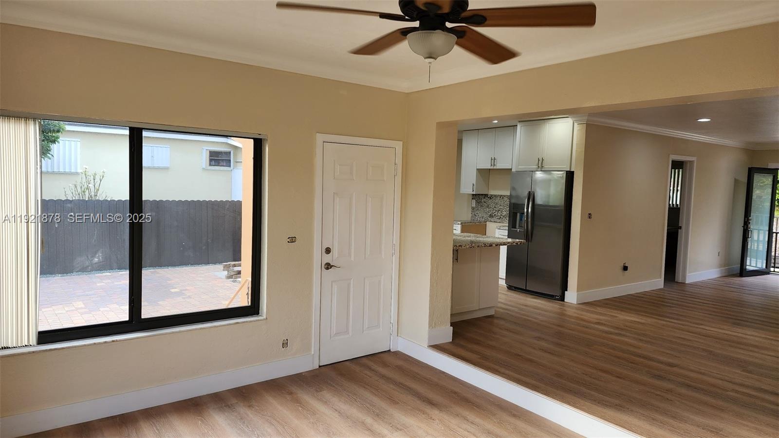 8010 Southwest 16th Street, Unit 8010 Miami, FL 33155 - Photo 12 of 33 a view of a hallway with wooden floor and a ceiling fan