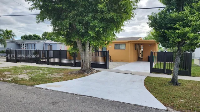 a house with swimming pool in front of it