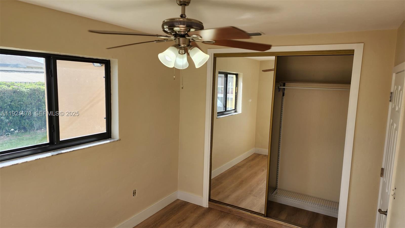 8010 Southwest 16th Street, Unit 8010 Miami, FL 33155 - Photo 25 of 33 a view of a hallway with a mirror and a window