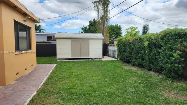 a view of backyard of a house