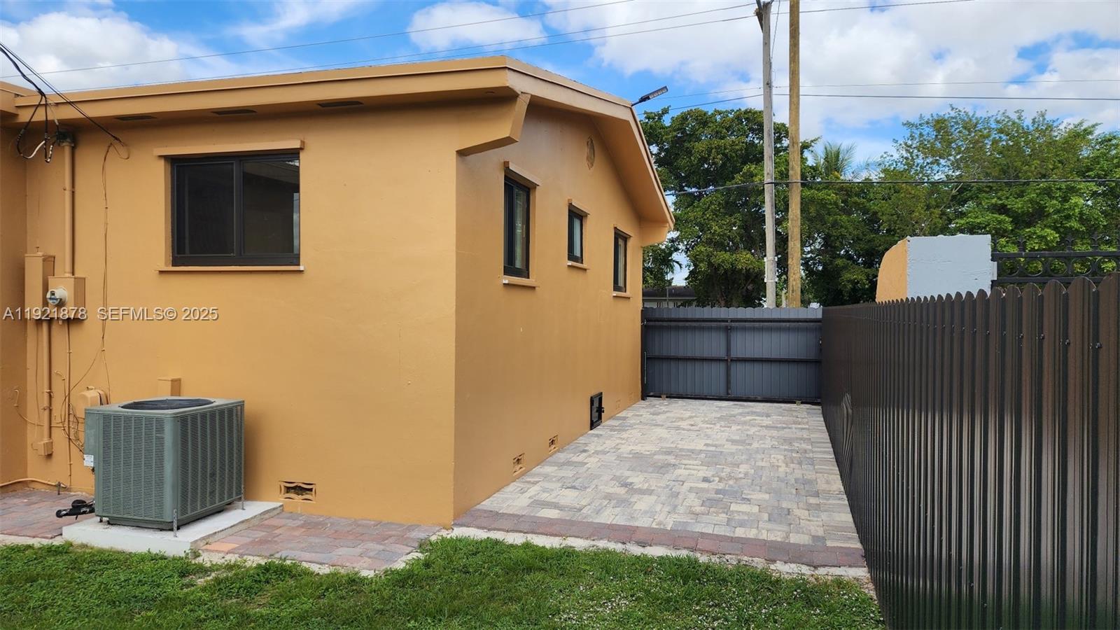 8010 Southwest 16th Street, Unit 8010 Miami, FL 33155 - Photo 31 of 33 a backyard of a house with lots of green space