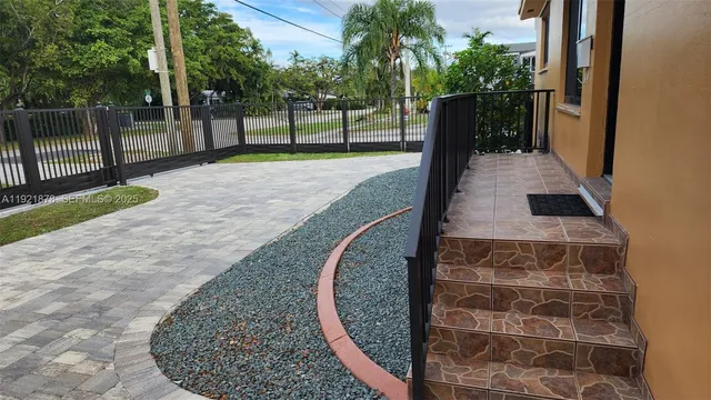 a view of a park with large trees