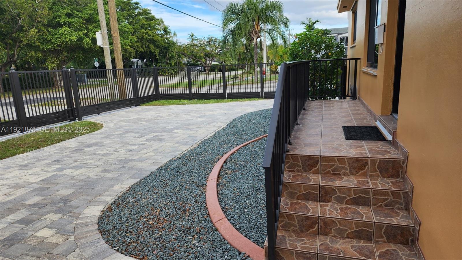 8010 Southwest 16th Street, Unit 8010 Miami, FL 33155 - Photo 4 of 33 a view of a backyard with wooden fence