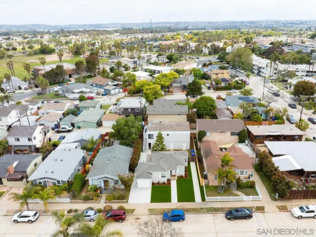 an aerial view of residential houses with outdoor space