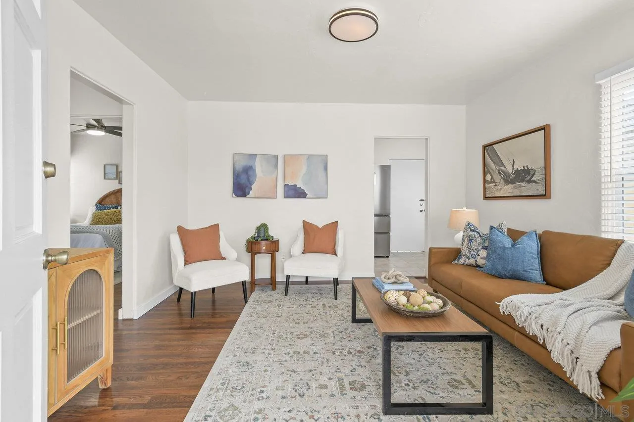 4614-4616 Larkspur Street San Diego, CA 92107 - Photo 16 of 51 a living room with furniture and wooden floor