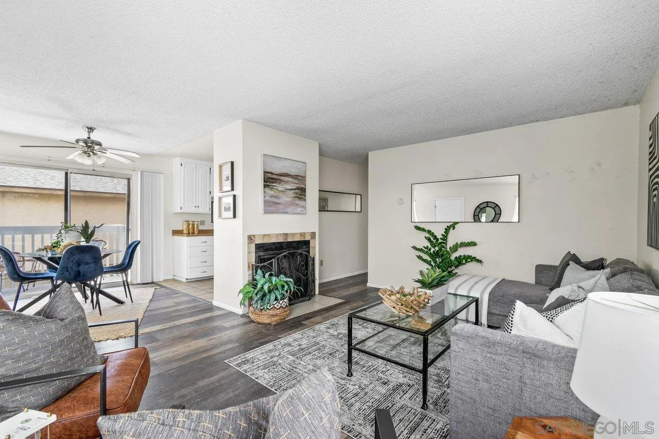 4614-4616 Larkspur Street San Diego, CA 92107 - Photo 28 of 51 a living room with furniture dining table a fireplace and a potted plant