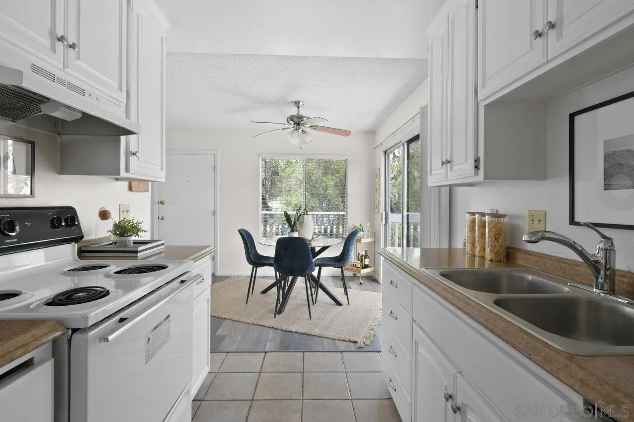 4614-4616 Larkspur Street San Diego, CA 92107 - Photo 36 of 51 a kitchen with a sink stove and cabinets