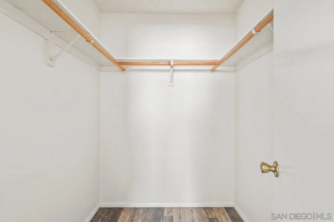 4614-4616 Larkspur Street San Diego, CA 92107 - Photo 38 of 51 a view of walk in closet with empty racks