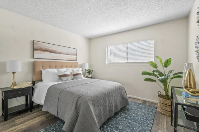 a bed room with a bed and a chair