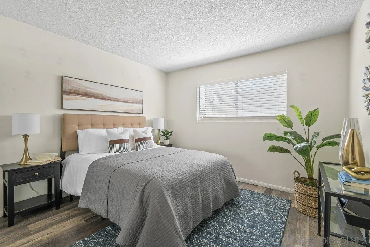 4614-4616 Larkspur Street San Diego, CA 92107 - Photo 40 of 51 a bedroom with a bed and a potted plant
