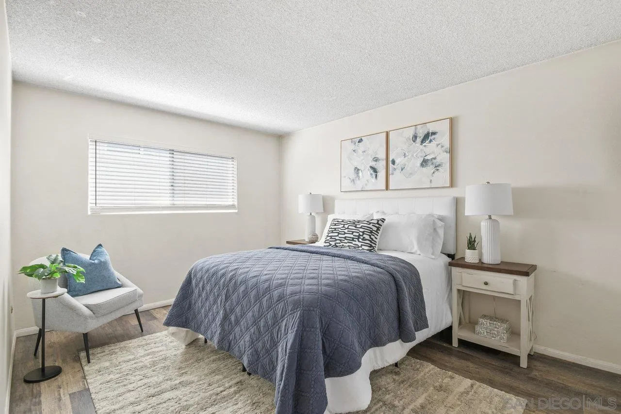 4614-4616 Larkspur Street San Diego, CA 92107 - Photo 41 of 51 a bed room with a bed and a chair