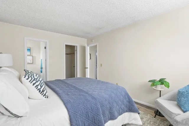 an aerial view of residential houses with outdoor space and parking