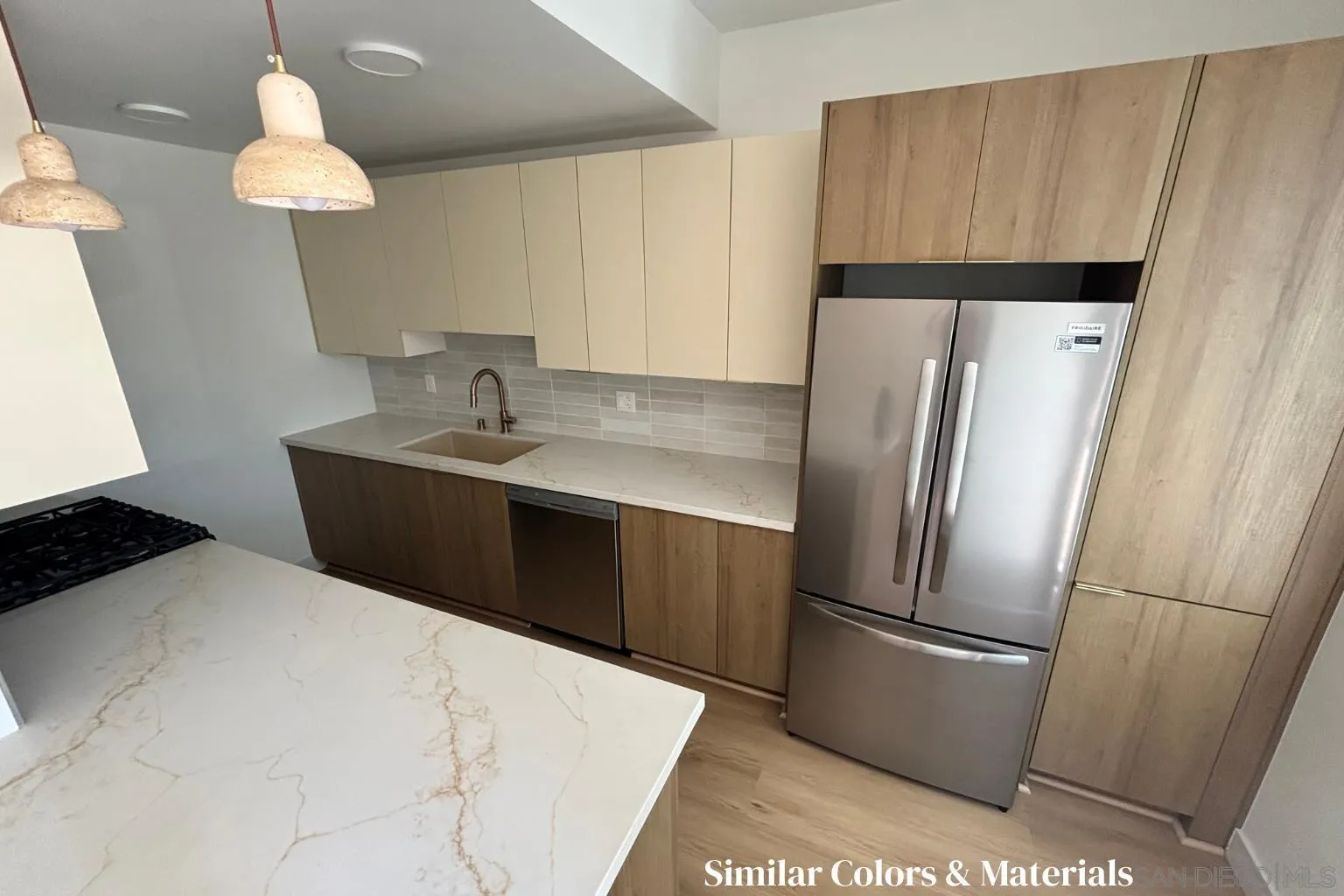 4614-4616 Larkspur Street San Diego, CA 92107 - Photo 50 of 51 a kitchen with stainless steel appliances a refrigerator and a sink