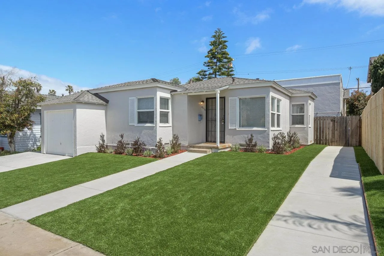 4614-4616 Larkspur Street San Diego, CA 92107 - Photo 6 of 51 a front view of a house with a yard