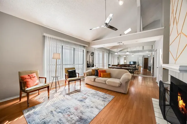 a living room with fireplace furniture and a flat screen tv