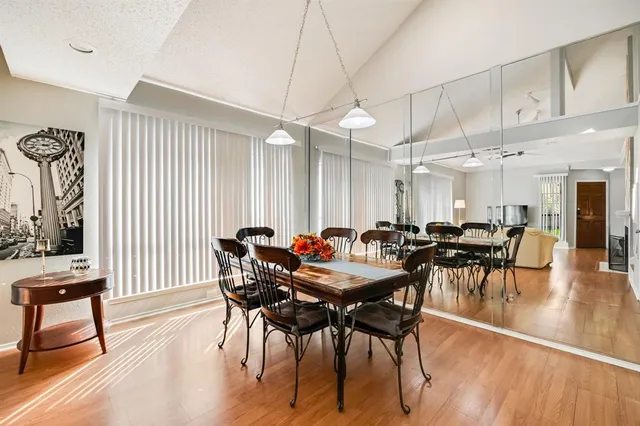 a view of a dining room with furniture window and wooden floor